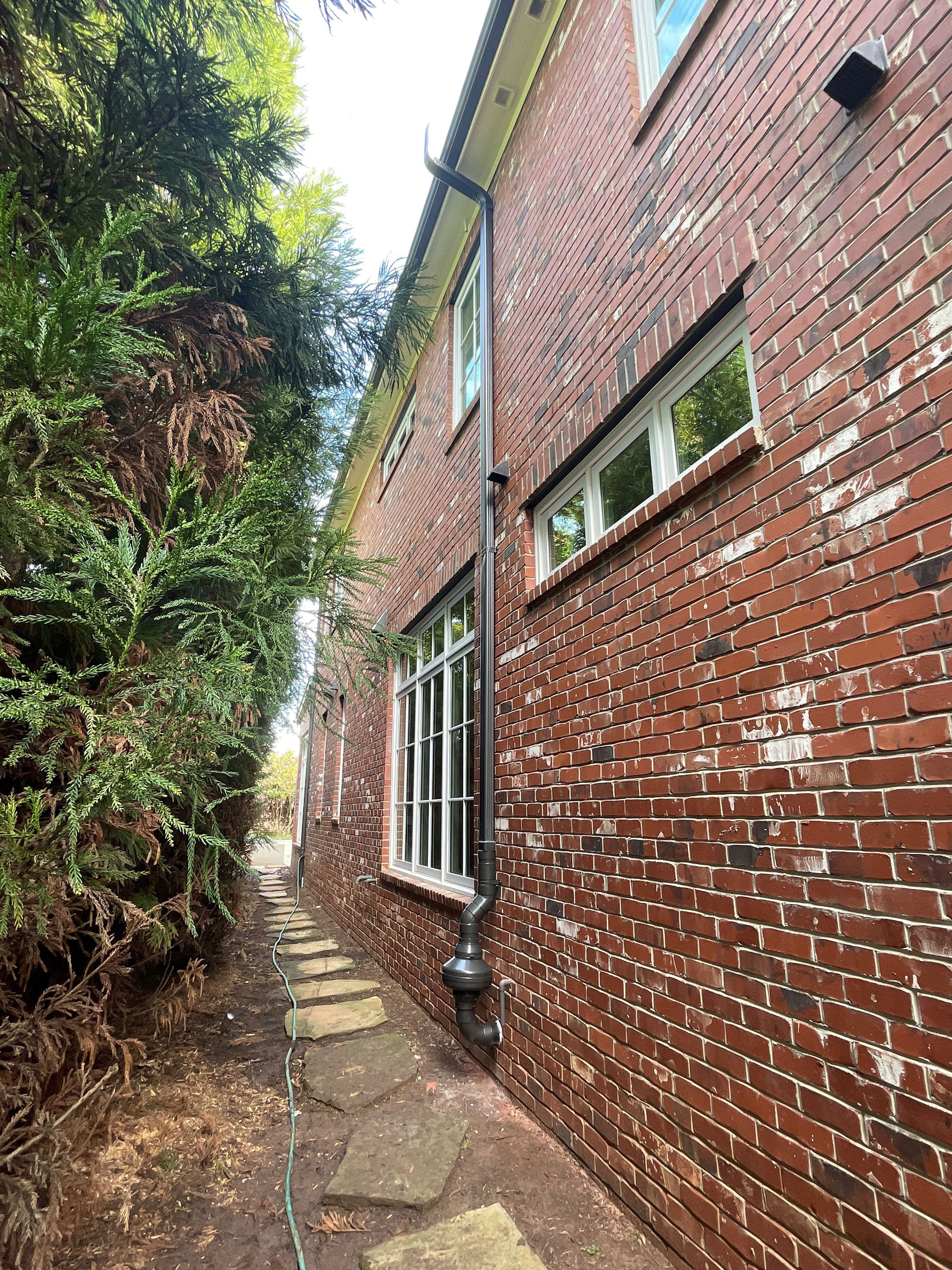 looking down the side of a brick building